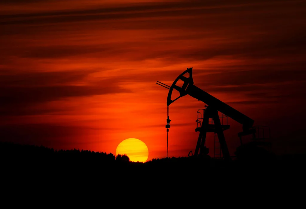 Oil wells at sunset